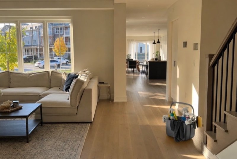 A spotless, bright open-plan living room staged for showings, the way the real estate industry presents a home